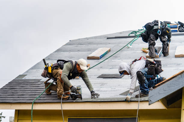 Professional Gutter Installation technician working in Weston, MA
